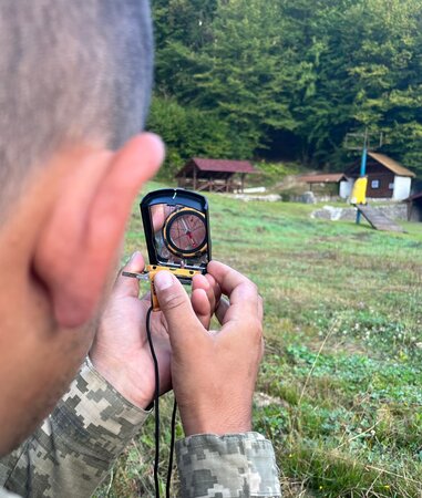 A person using the compass