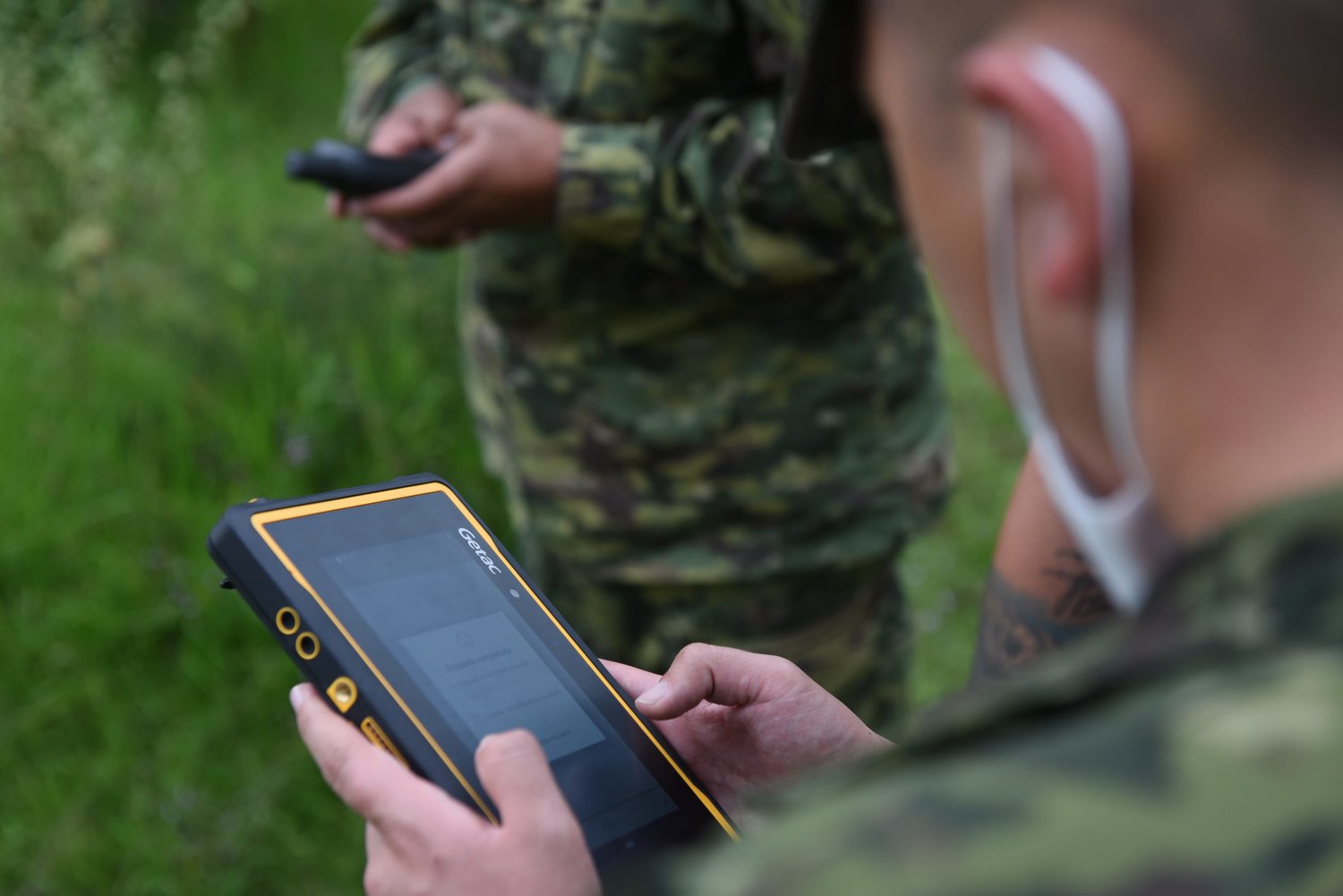 Solider using mine detection technology